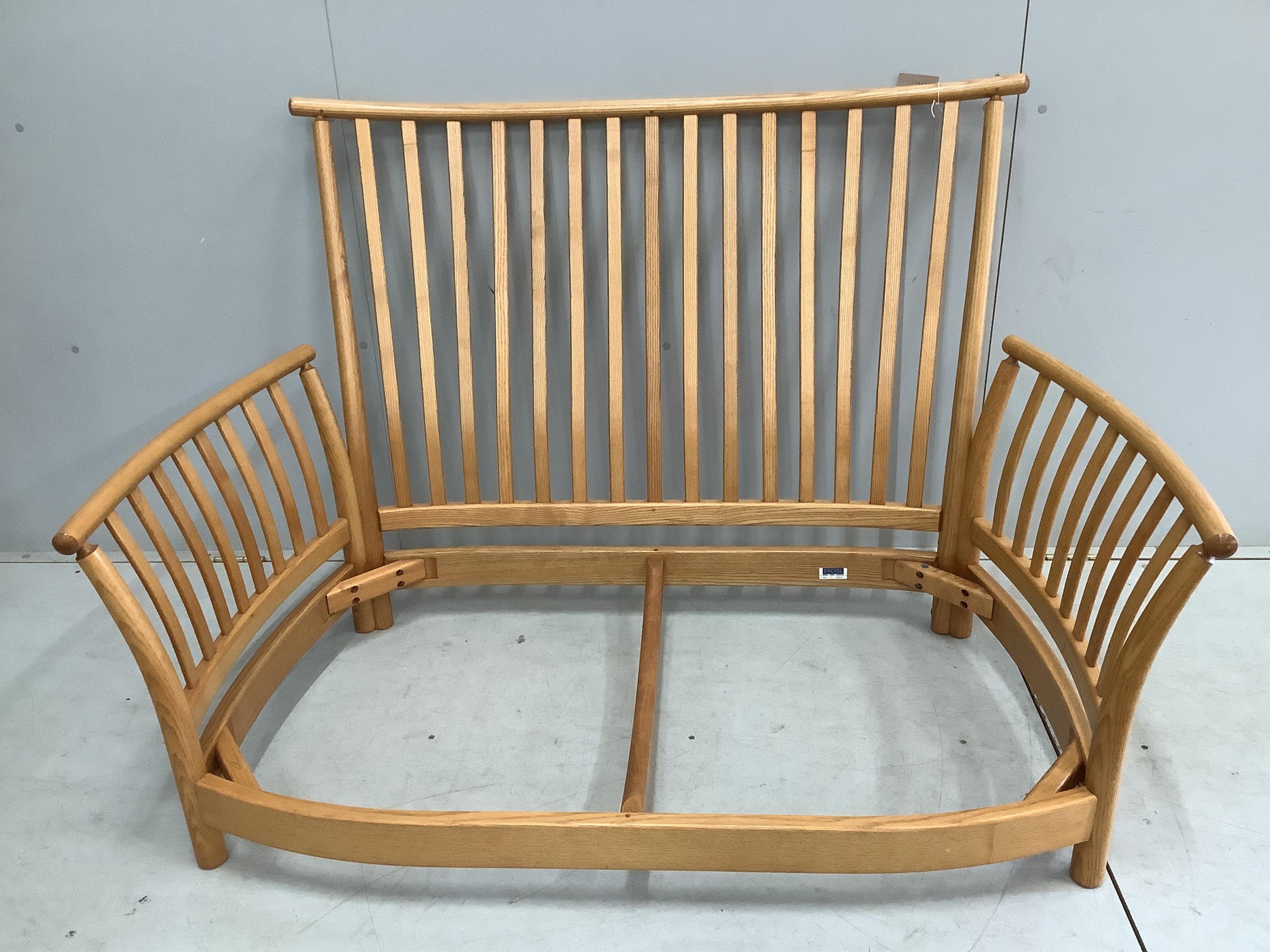 An Ercol ash 'Renaissance' two seater settee, width 144cm, depth 90cm, height 96cm